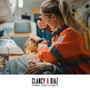 A personal injury victim in the back of an ambulance with a paramedic