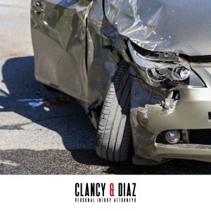 A close-up of the dented front bumper of a car, following a Benicia car accident