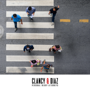 Aerial view of pedestrians in Brentwood crossing the street in a marked crosswalk