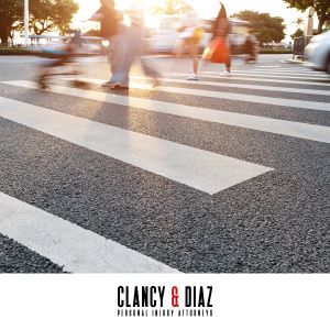 A crosswalk filled with pedestrians on a busy street in Concord, California.