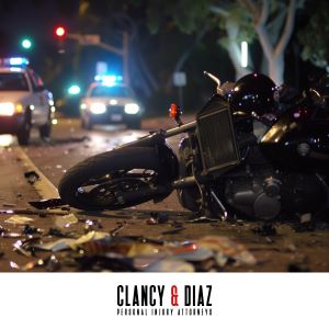 After a nighttime motorcycle accident in Walnut Creek, a motorcycle lies in the road surrounded by debris